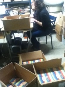 Melissa, one of the project directors, unpacking our new book!